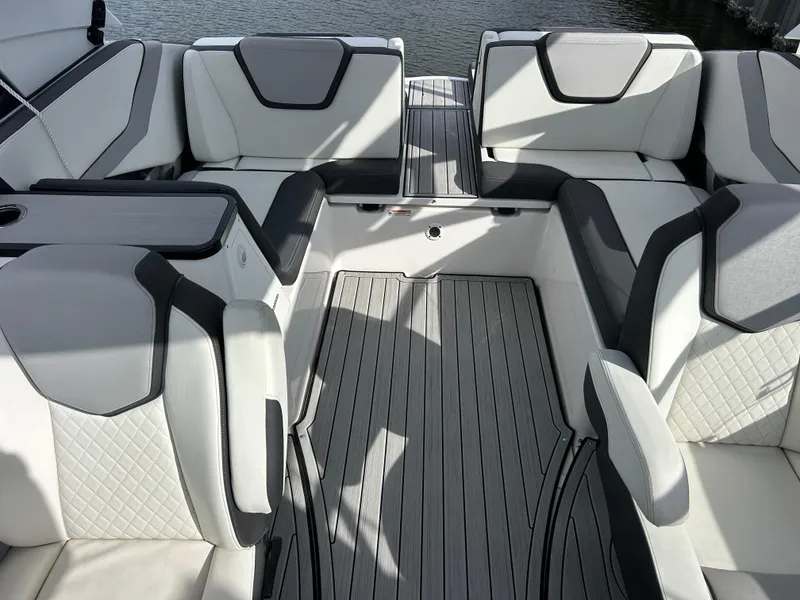 Slide: The Image of 2023 Yamaha Boats 252SD interior with sleek, modern seating and elegant design. - 34