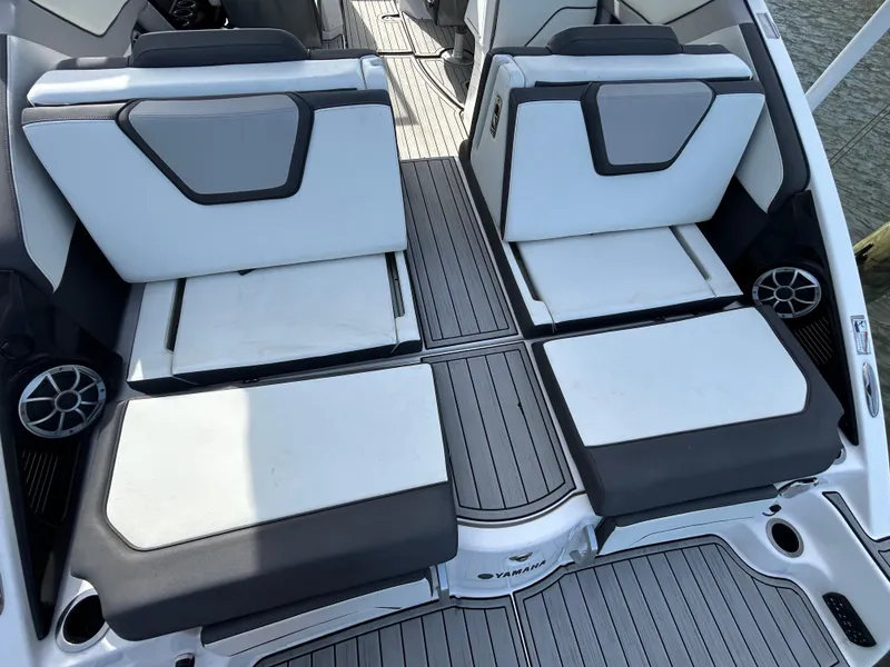 Slide: The Image of 2023 Yamaha Boats 252SD interior seating with modern design and gray accents. - 37