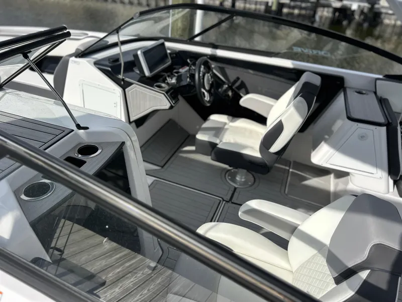 Slide: The Image of 2023 Yamaha Boats 252SD interior with modern dashboard and seating. - 5