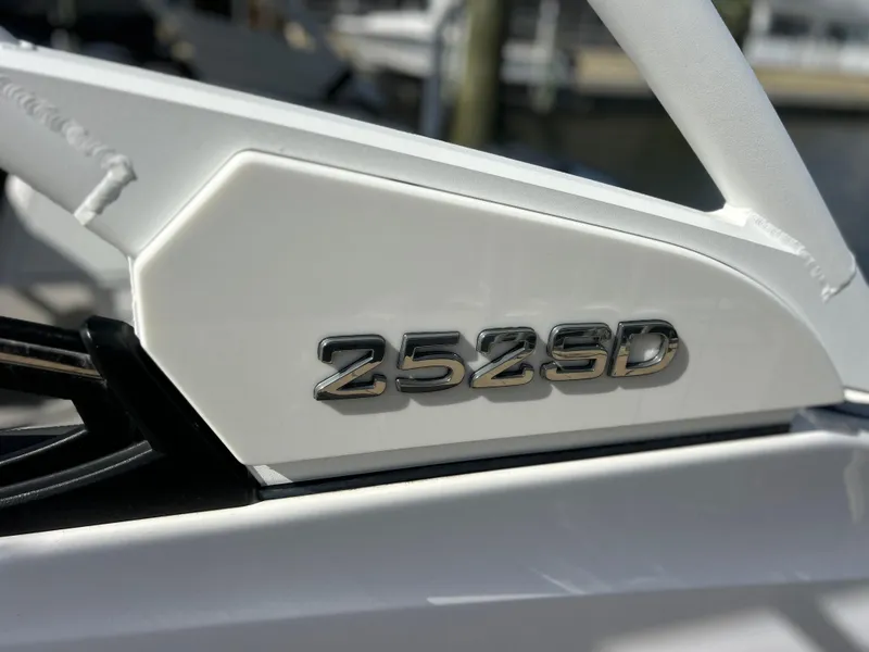 Slide: The Image of 2023 Yamaha Boats 252SD model emblem on a sleek white surface. - 8