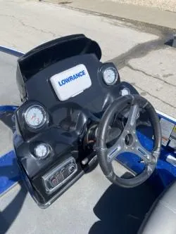 Slide: The Image of Nitro Z18 2019 boat dashboard with Lowrance display and steering wheel. - 3