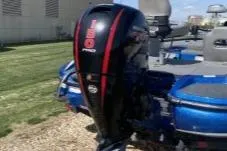 Slide: The Image of 2019 Nitro Z18 boat with 150 Pro outboard motor, parked on grass. - 4