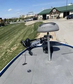 Slide: The Image of 2019 Nitro Z18 boat with trolling motor on a sunny day near a building. - 5