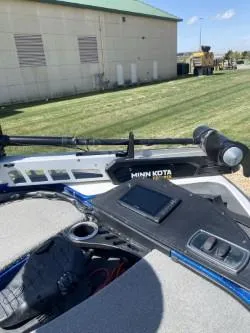 Slide: The Image of 2019 Nitro Z18 boat with Minn Kota trolling motor on grassy area. - 6