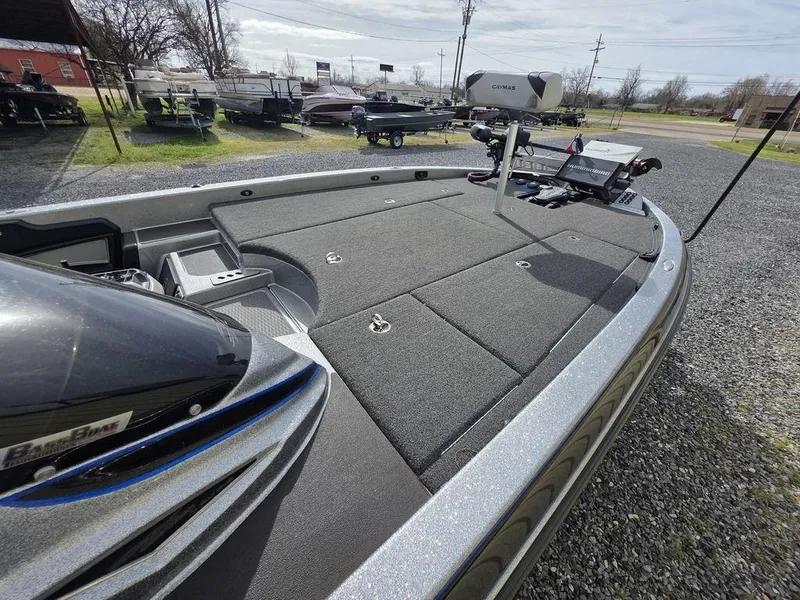 Slide: The Image of 2021 Caymas CX 21 boat deck with advanced fishing equipment and sleek design. - 12