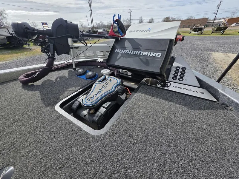 Slide: The Image of 2021 Caymas CX 21 boat dashboard with Humminbird and Garmin electronics. - 13