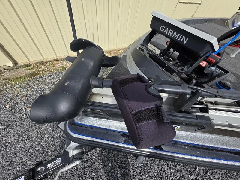 Slide: The Image of 2021 Caymas CX 21 boat with Garmin equipment and trolling motor on gravel surface. - 18