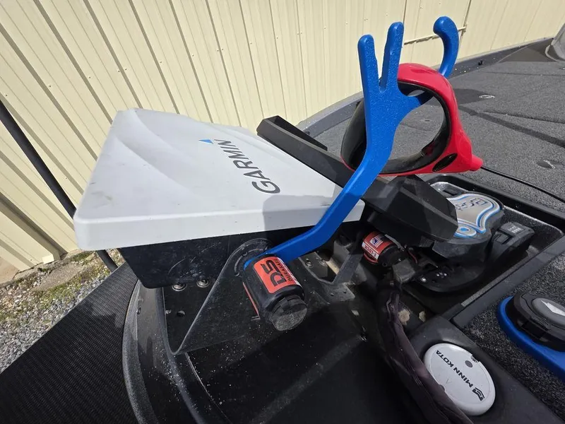 Slide: The Image of Garmin device on 2021 Caymas CX 21 boat with blue and red accessories. - 19