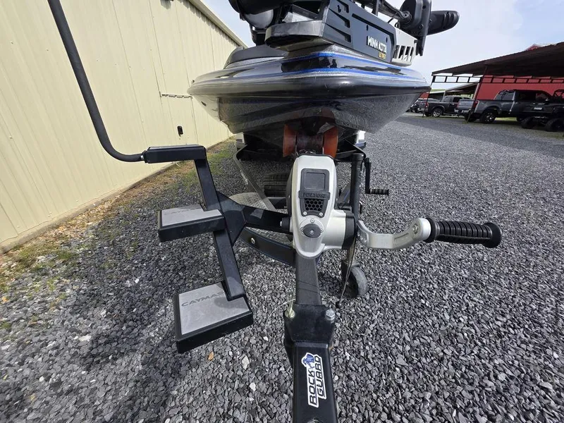 Slide: The Image of 2021 Caymas CX 21 boat trailer hitch and winch on gravel driveway. - 23