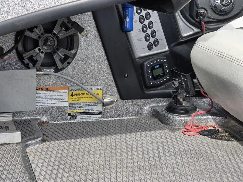 Slide: The Image of 2021 Caymas CX 21 boat interior with control panel, speaker, and seating area. - 25