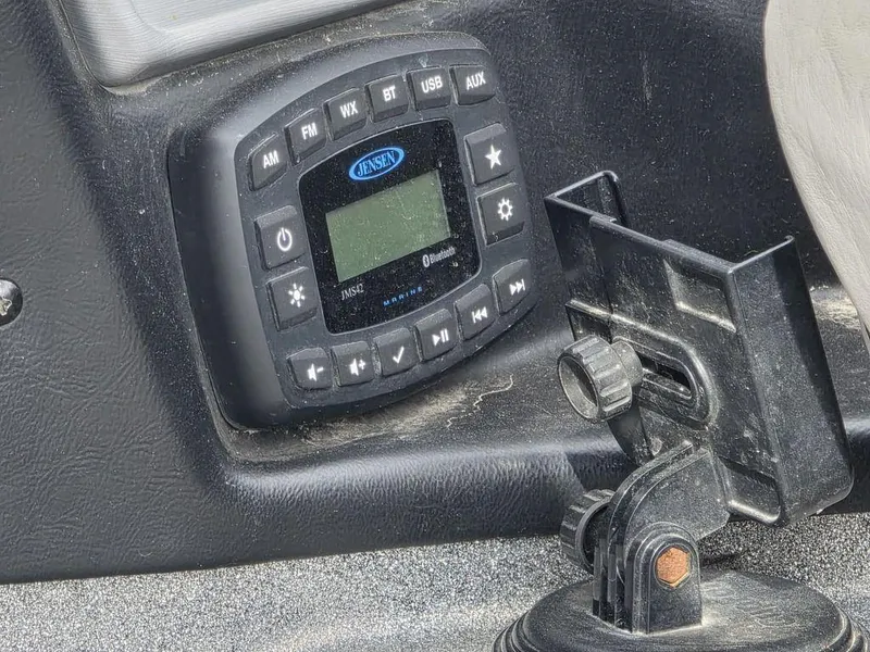 Slide: The Image of 2021 Caymas CX 21 dashboard with Jensen audio system and mounting bracket. - 26