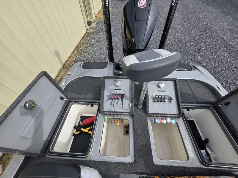 Slide: The Image of 2021 Caymas CX 21 boat interior with storage compartments and fishing gear. - 28