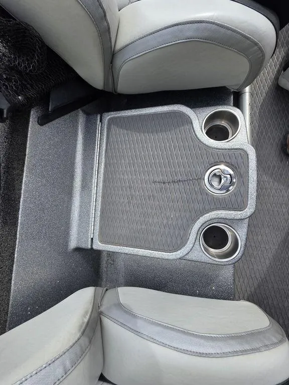 Slide: The Image of 2021 Caymas CX 21 boat interior with cup holders and seating area. - 32