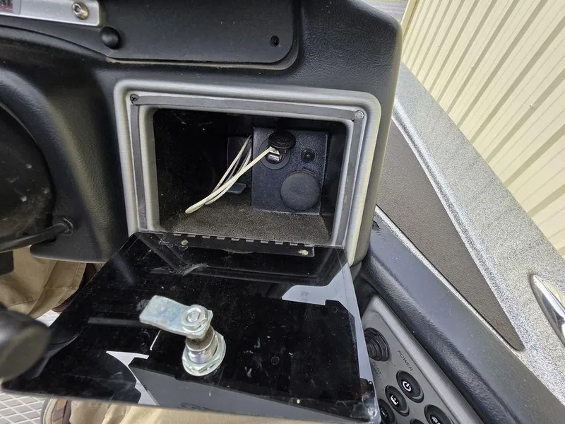 Slide: The Image of Interior compartment of a 2021 Caymas CX 21 boat, showing open storage with wiring. - 33