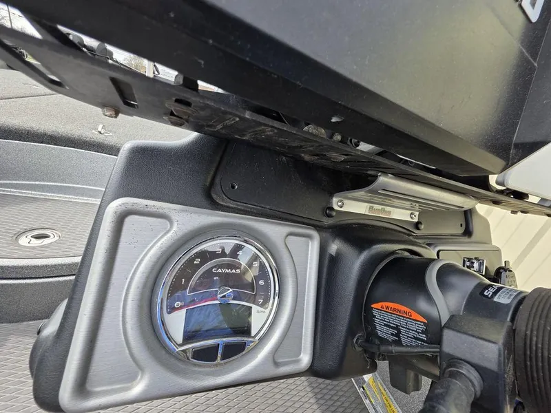 Slide: The Image of Dashboard of 2021 Caymas CX 21 boat with gauge and controls. - 35