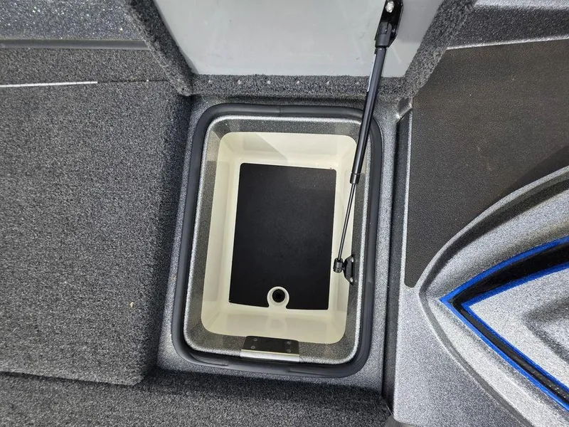 Slide: The Image of 2021 Caymas CX 21 boat storage compartment with open lid, featuring a hydraulic lift. - 37