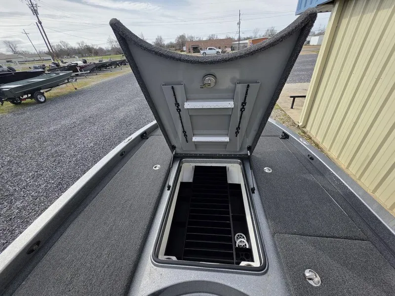 Slide: The Image of 2021 Caymas CX 21 boat with open storage compartment, showcasing interior design. - 38