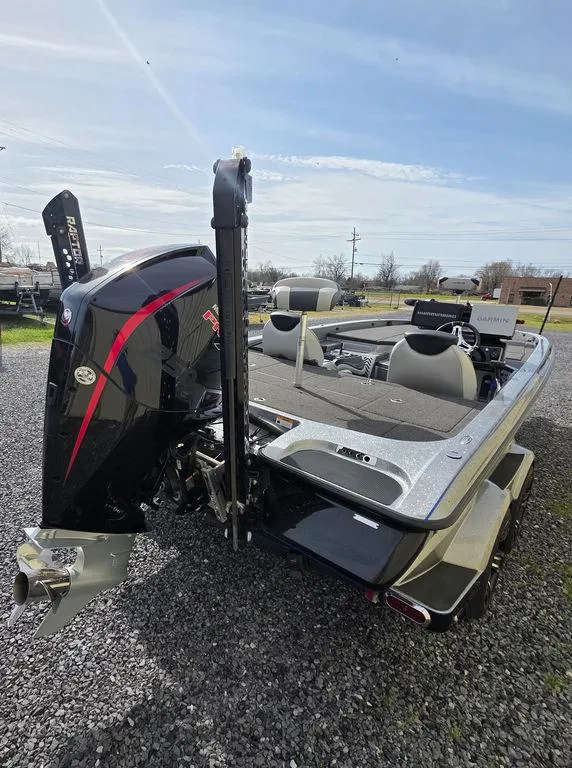 Slide: The Image of 2021 Caymas CX 21 boat with powerful outboard motor, parked on gravel. - 4