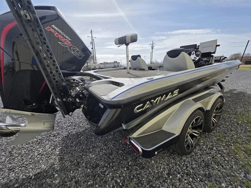 Slide: The Image of 2021 Caymas CX 21 boat with powerful engine, parked on gravel. - 6