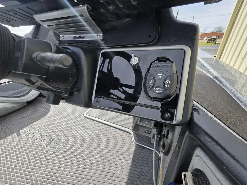 Slide: The Image of 2021 Caymas CX 21 boat dashboard with control panel and steering wheel. - 9