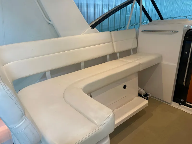 Slide: The Image of 2002 Tiara Yachts 3500 Open interior seating with white upholstery. - 10