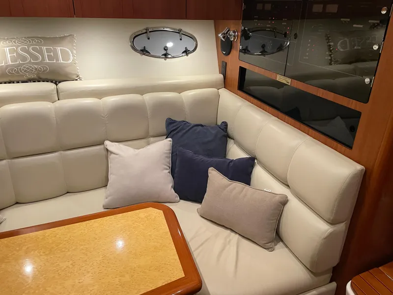 Slide: The Image of Luxurious interior of 2002 Tiara Yachts 3500 Open with plush seating and cushions. - 19