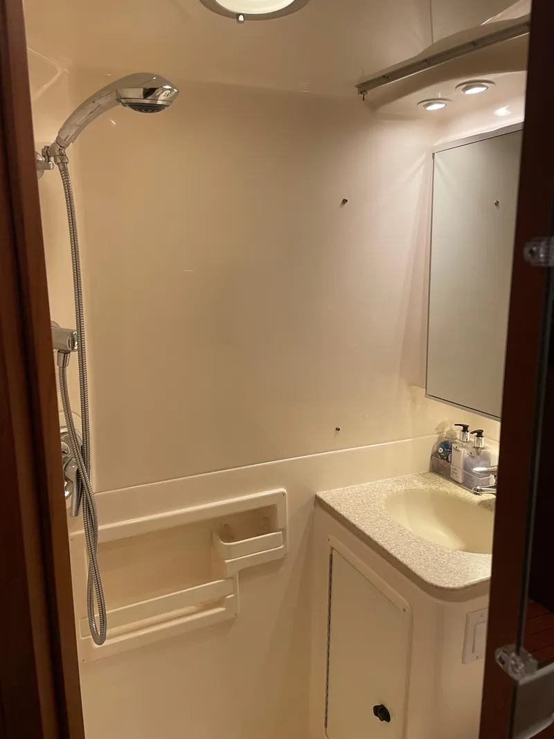 Slide: The Image of Bathroom interior of 2002 Tiara Yachts 3500 Open with shower and sink. - 26