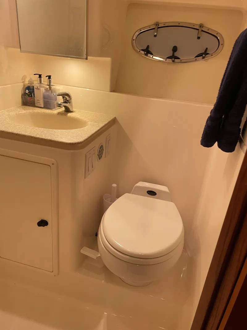 Slide: The Image of Bathroom interior of a 2002 Tiara Yachts 3500 Open, featuring a sink and toilet. - 27