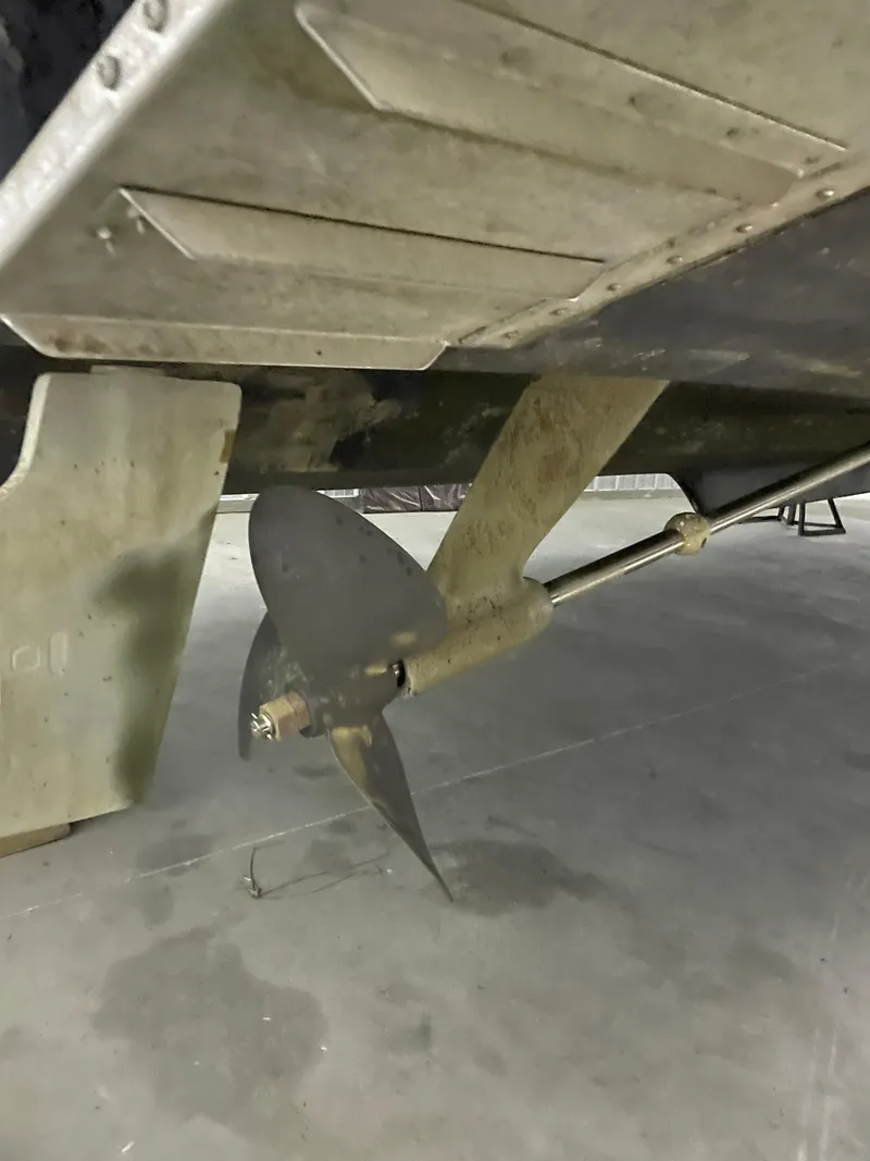 Slide: The Image of Propeller and shaft of a 2002 Tiara Yachts 3500 Open, in a dry dock setting. - 29