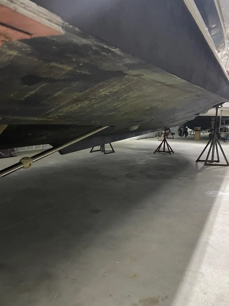 Slide: The Image of 2002 Tiara Yachts 3500 Open hull on stands in a storage facility. - 30