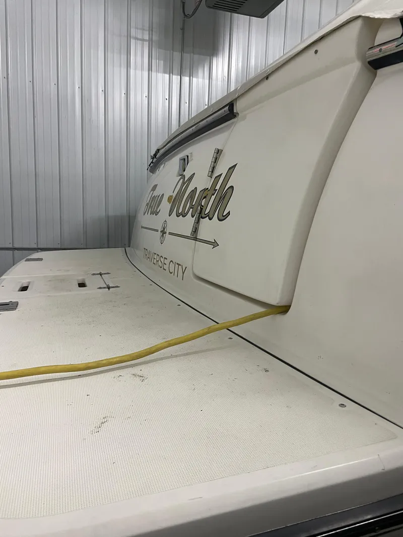 Slide: The Image of 2002 Tiara Yachts 3500 Open in storage, Traverse City, with yellow power cable. - 31