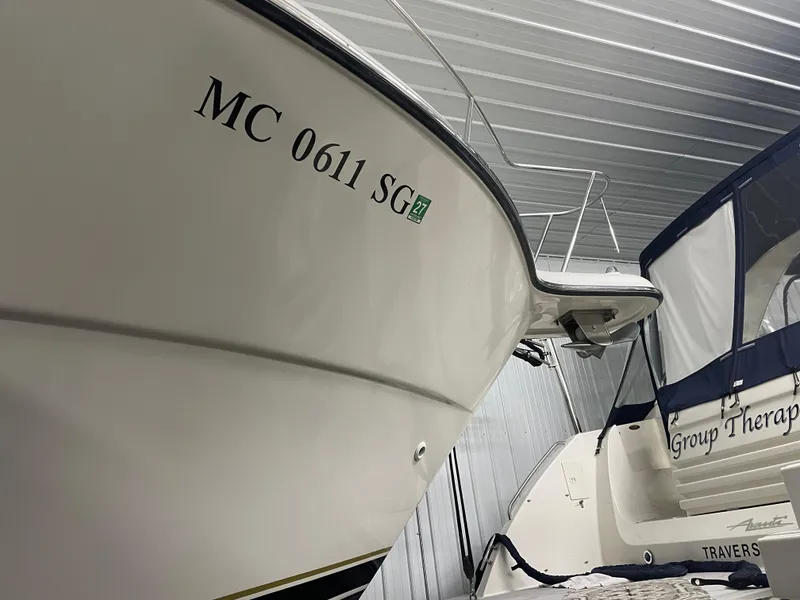 Slide: The Image of 2002 Tiara Yachts 3500 Open in storage, side view with registration number visible. - 33