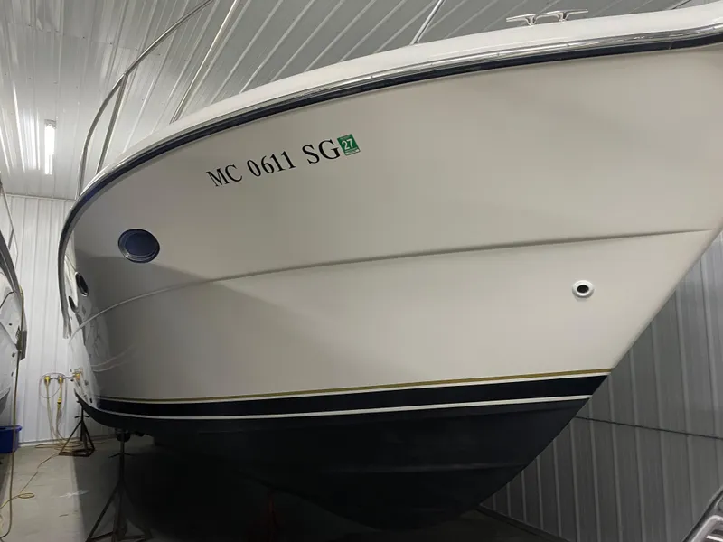 Slide: The Image of 2002 Tiara Yachts 3500 Open in storage, side view with registration number visible. - 34