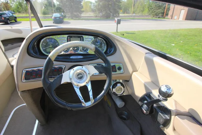 Slide: The Image of 2007 Malibu Wakesetter 23 LSV dashboard with steering wheel and controls. - 11