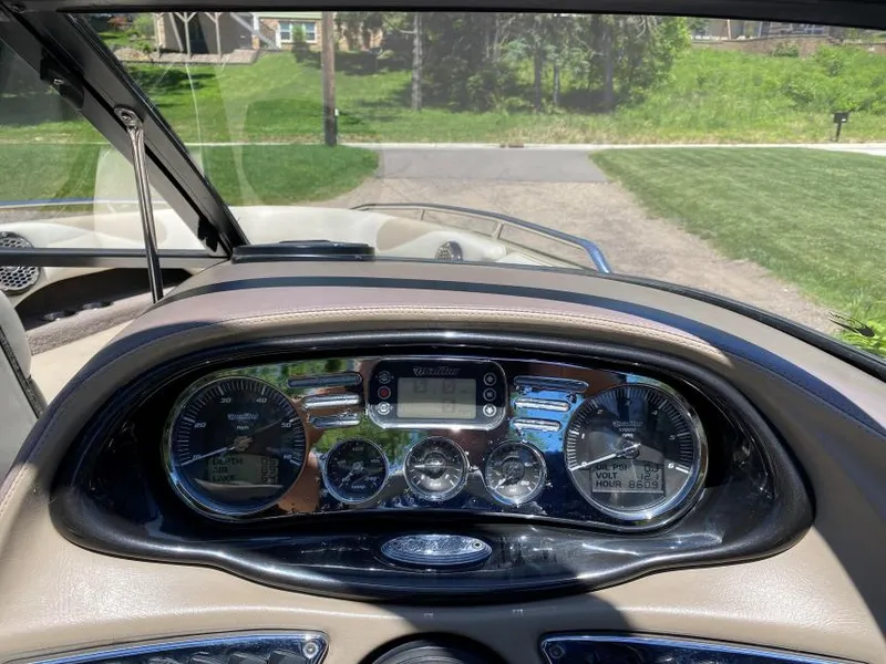 Slide: The Image of Dashboard of a 2007 Malibu Wakesetter 23 LSV boat with gauges and controls. - 12