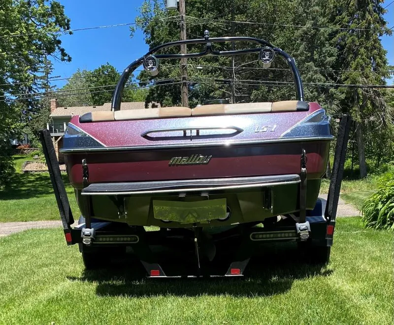 Slide: The Image of 2007 Malibu Wakesetter 23 LSV boat on grass, rear view. - 3