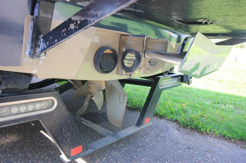 Slide: The Image of 2007 Malibu Wakesetter 23 LSV boat propeller and rudder detail on trailer. - 4