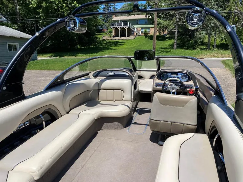 Slide: The Image of 2007 Malibu Wakesetter 23 LSV interior with beige seating and sleek dashboard design. - 5