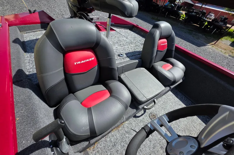 Slide: The Image of 2025 Tracker Pro Team 175 TXW Tournament Edition boat seats, black and red design. - 13