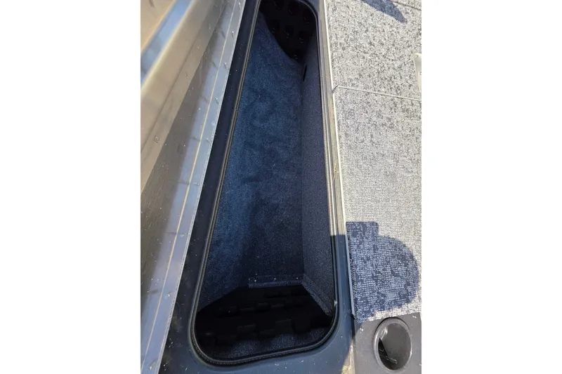 Slide: The Image of Storage compartment of 2025 Tracker Pro Team 175 TXW Tournament Edition boat. - 22