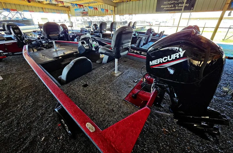 Slide: The Image of 2025 Tracker Pro Team 175 TXW® boat with Mercury engine in showroom display. - 3