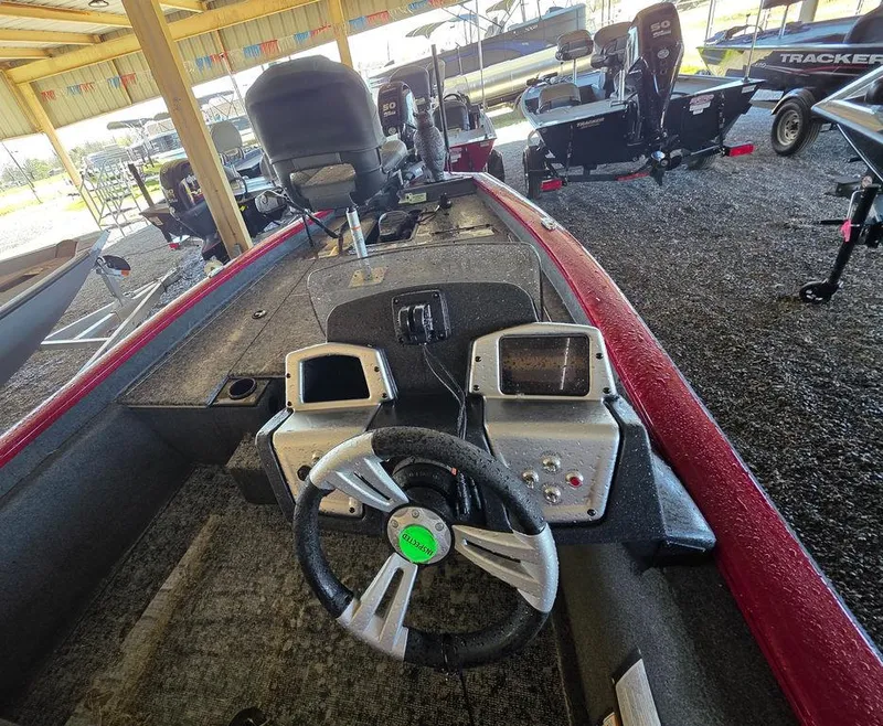 Slide: The Image of 2025 Tracker Pro Team 175 TXW® boat interior with steering wheel and control panels. - 5