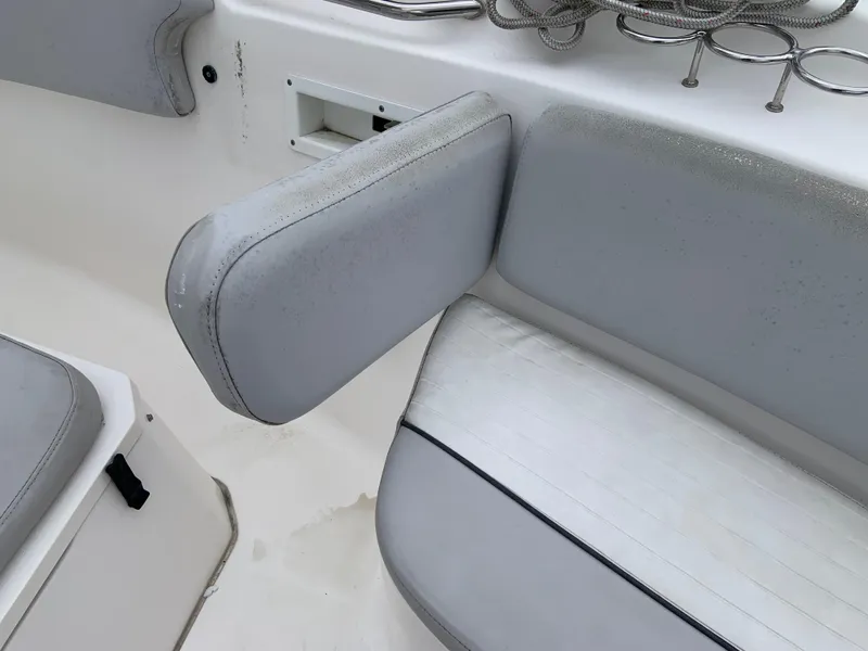 Slide: The Image of 2019 Sea Fox 266 Commander boat interior with gray cushioned seating and armrest. - 11