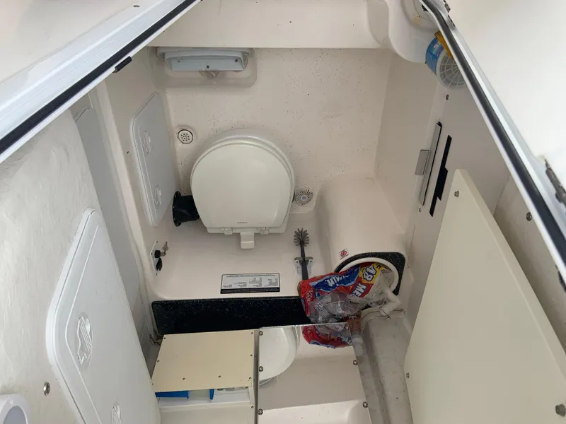 Slide: The Image of 2019 Sea Fox 266 Commander boat interior with toilet and storage area. - 13