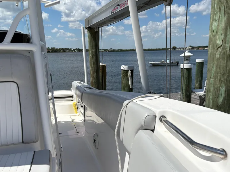 Slide: The Image of 2019 Sea Fox 266 Commander boat docked by a scenic waterfront. - 21