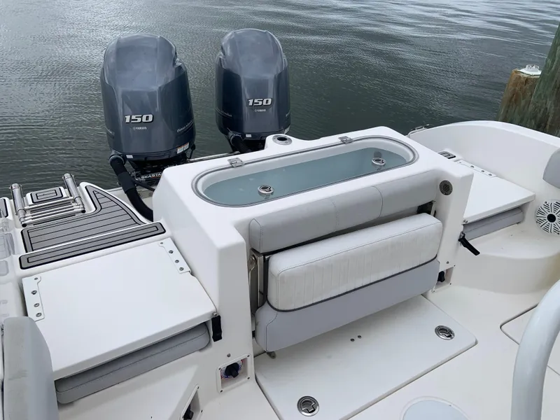 Slide: The Image of 2019 Sea Fox 266 Commander boat with dual 150 horsepower engines, featuring a spacious deck. - 5