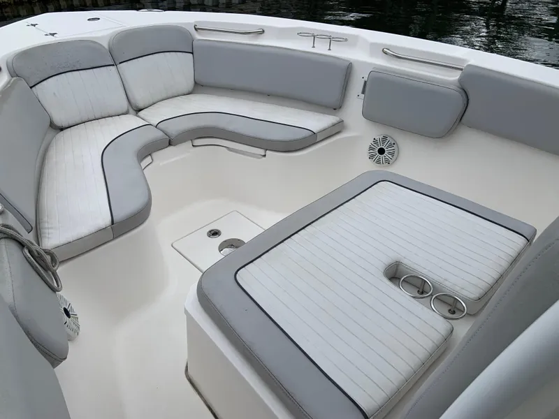 Slide: The Image of 2019 Sea Fox 266 Commander boat interior with cushioned seating and cup holders. - 7