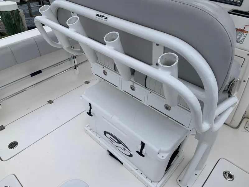 Slide: The Image of 2019 Sea Fox 266 Commander boat interior with rod holders and storage compartments. - 8
