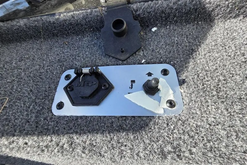 Slide: The Image of 2025 Tracker Pro Team 175 Crappie Edition boat with dual seats and carpeted deck. - 10