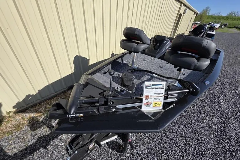 Slide: The Image of 2025 Tracker Pro Team 175 Crappie Edition boat interior with foot pedal and carpeted deck. - 11